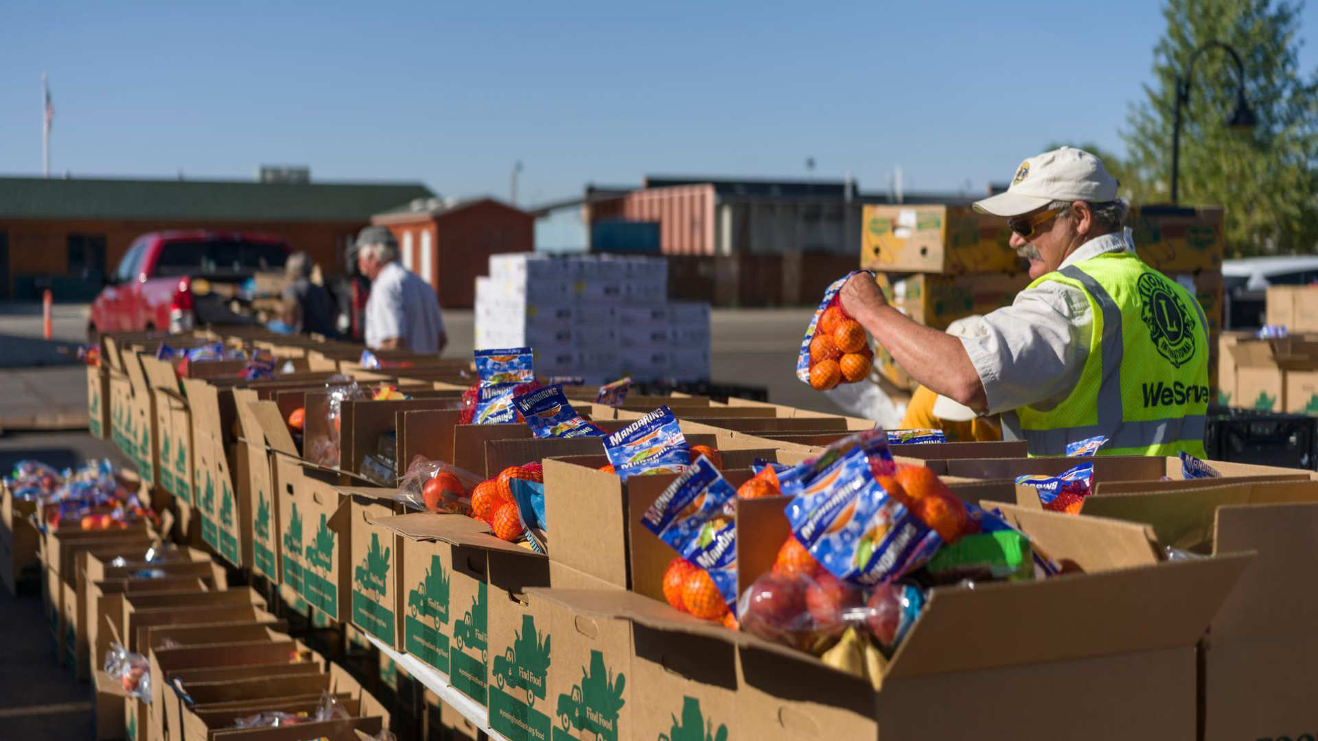 A volunteer with Food Bank of Wyoming helps sort and pack food at a mobile pantry in Pinedale in October 2025.