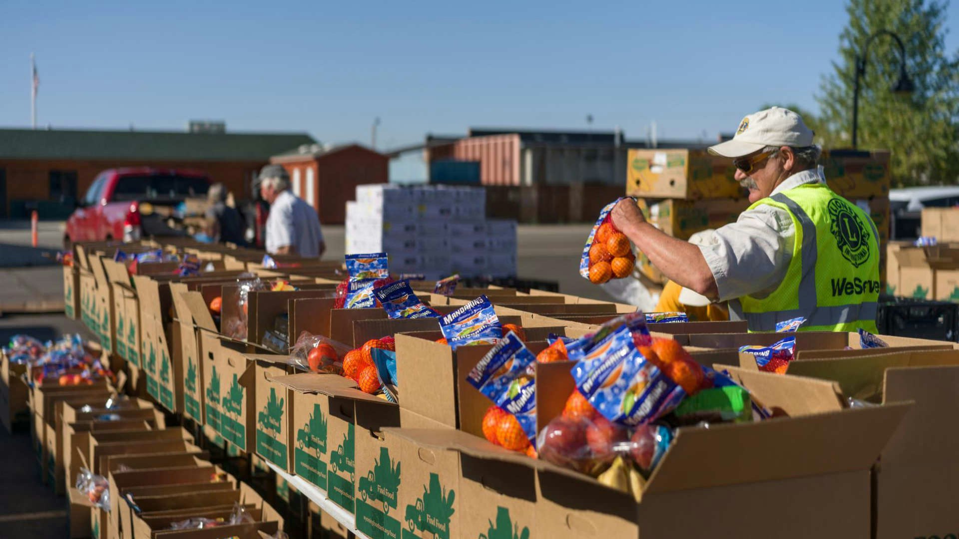 A volunteer with Food Bank of Wyoming helps sort and pack food at a mobile pantry in Pinedale in October 2025.