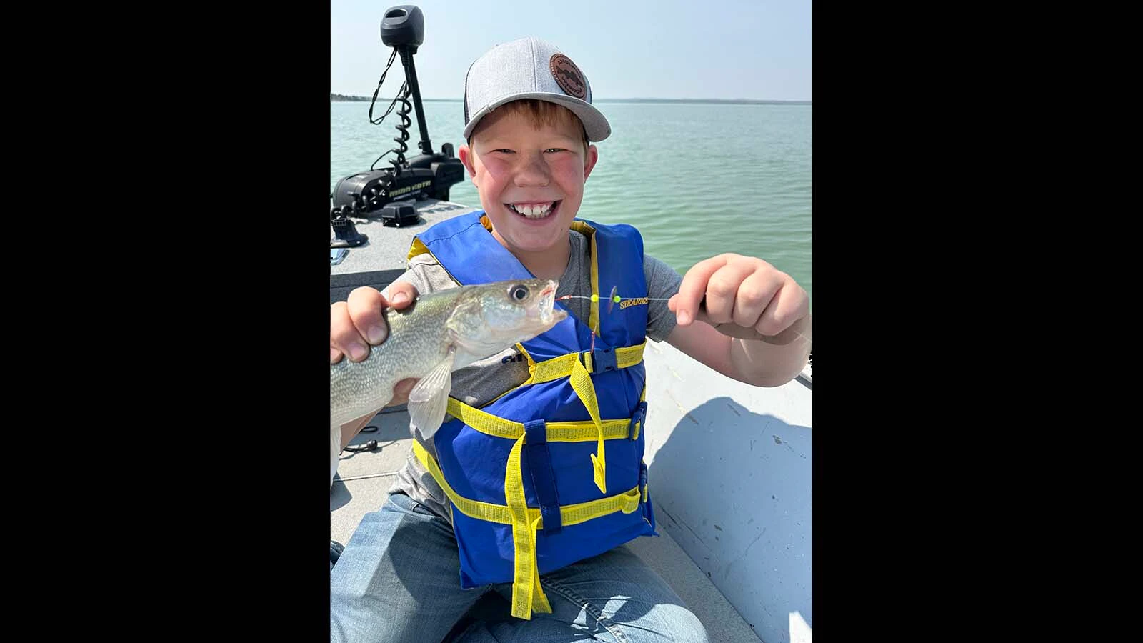 Ben Edwards of Fremont County poses with a walleye, one of Wyoming’s most popular game fish.
