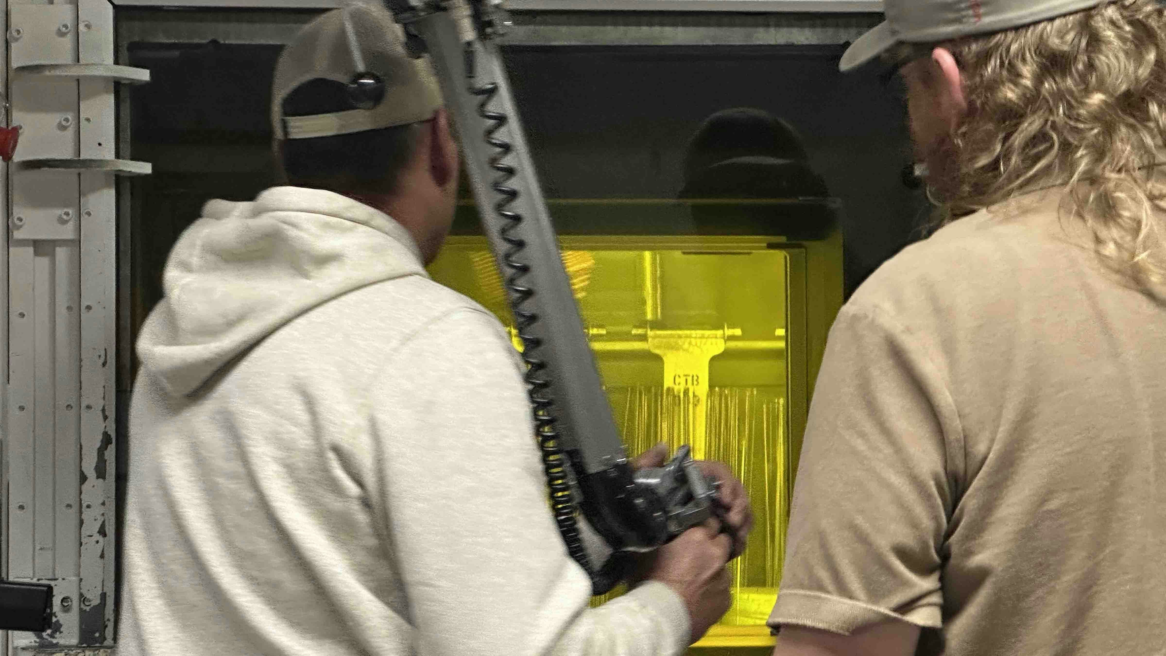 U.S. Energy Secretary Chris Wright took the controls of a robotic arm operating behind five feet of protective glass. He was at the controls of a high-tech version of an arcade mechanical claw machine. Instead of snatching stuffed animals and other prizes, this mechanical arm is designed to grip highly radioactive spent nuclear fuel.