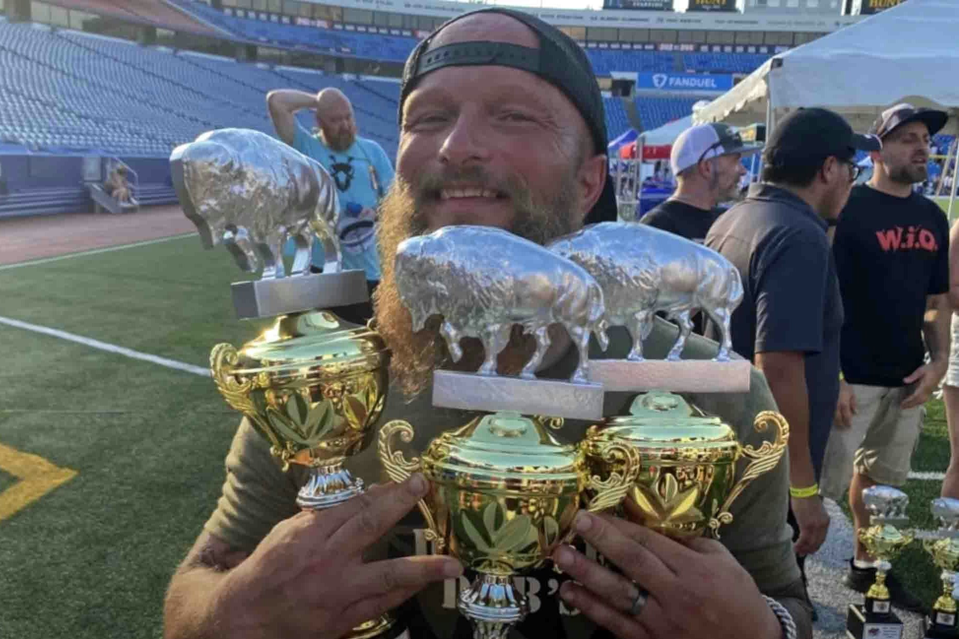 Trent Weitzel with a handful of trophies won at the 2022 National Buffalo Wing Festival in Buffalo, New York, including the coveted Festival Favorite.