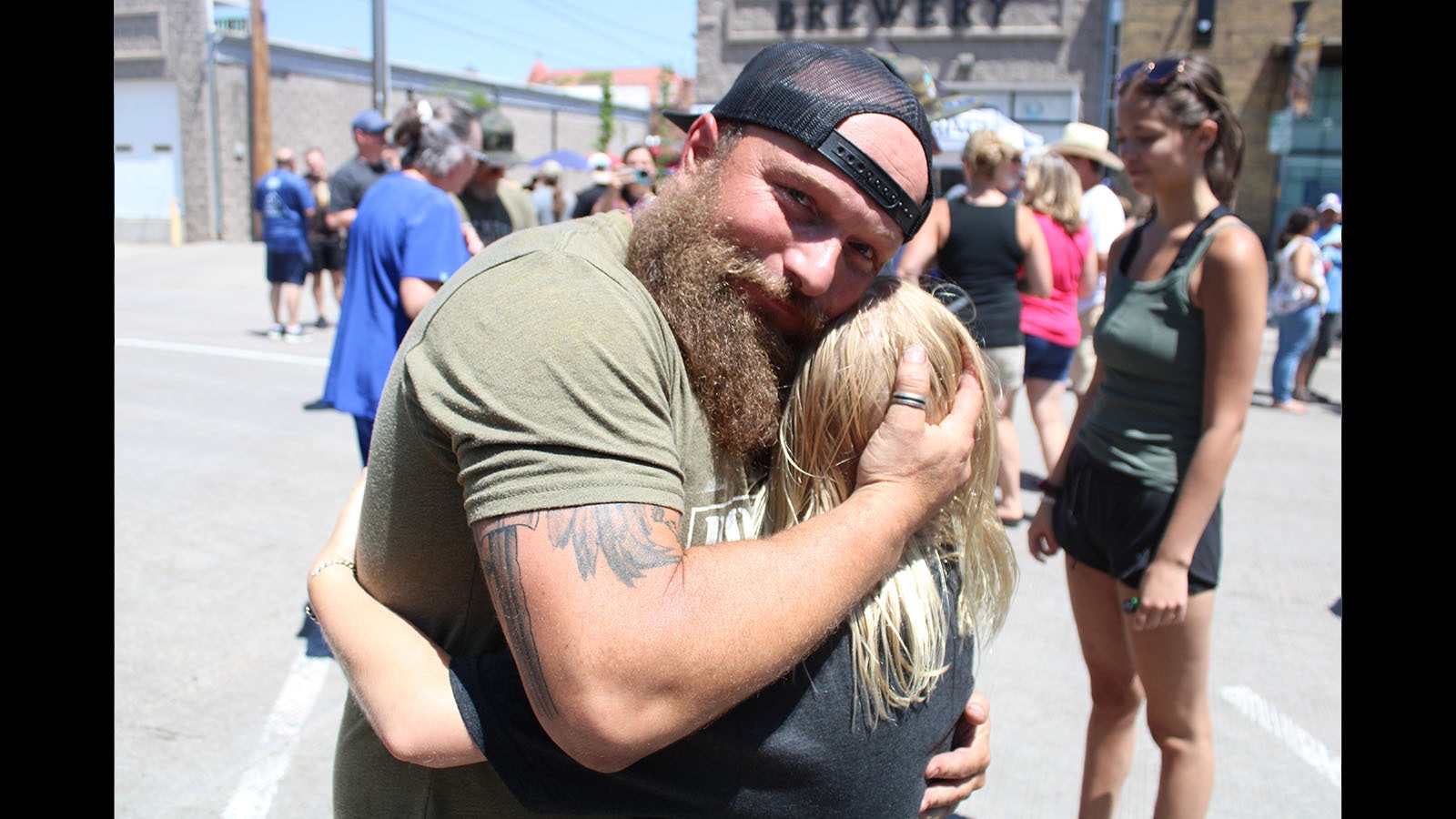 Trent Weitzel hugs his daughter after the world record announcement Saturday.