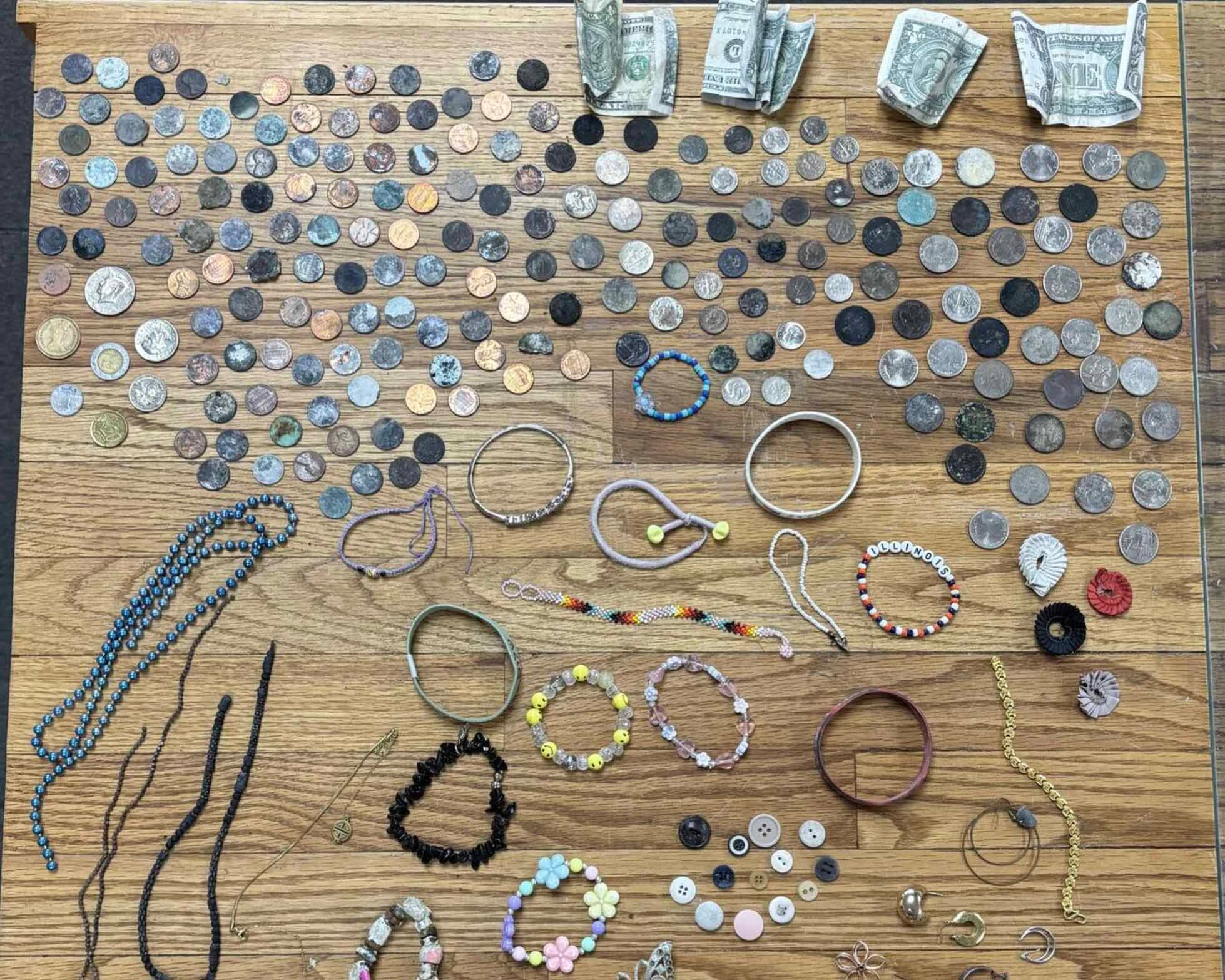 Coins, bills, and jewelry collected by the Yellowstone National Park Geology Team from hydrothermal areas during the summer season in 2026.