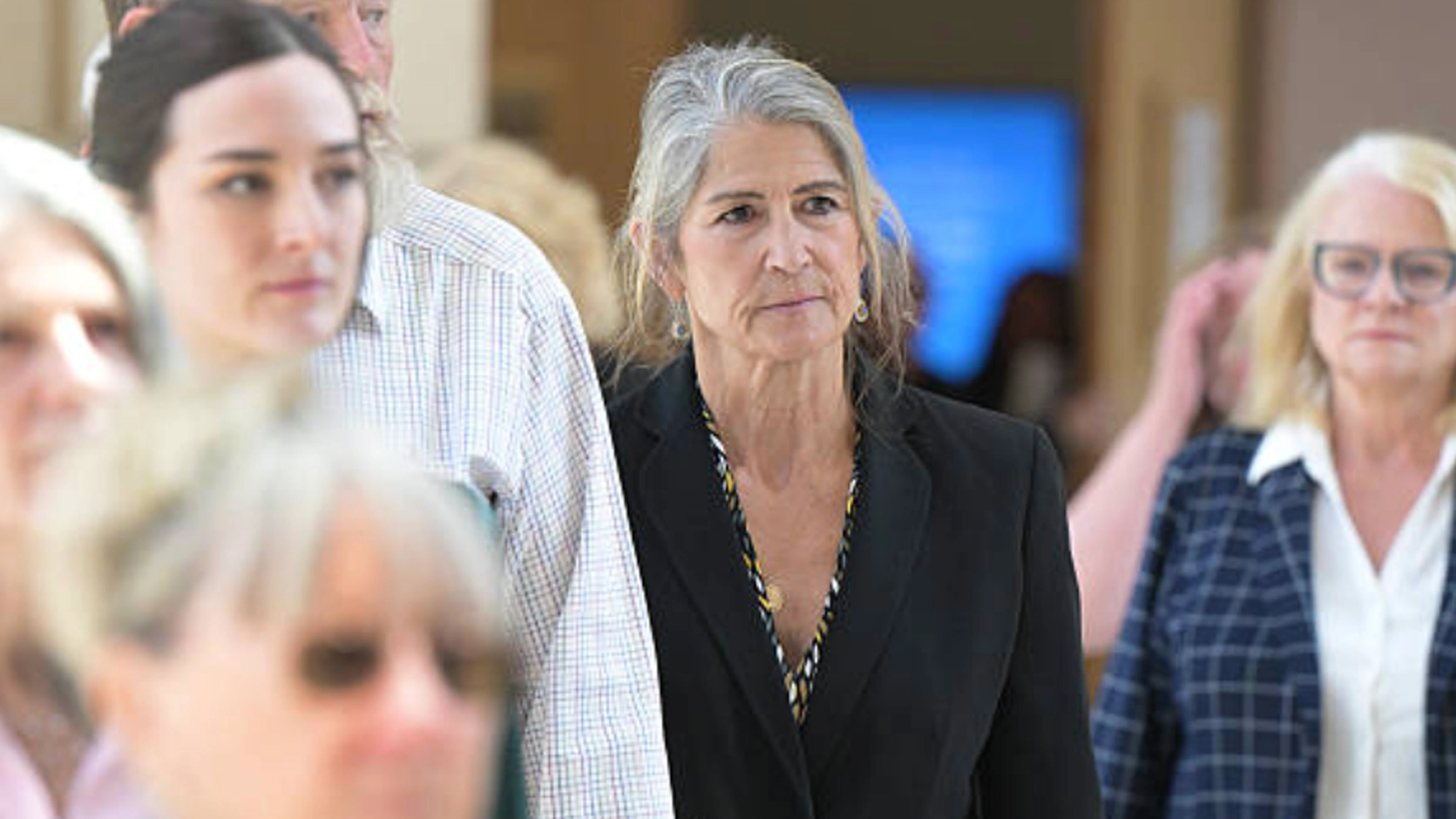 Former Colorado Bureau of Investigation forensic scientist Yvonne "Missy" Woods, center, leaves at Jefferson County District Court in Golden, Colorado on Tuesday, June 23, 2026. Woods pleaded guilty to four felonies in connection with a DNA testing scandal.